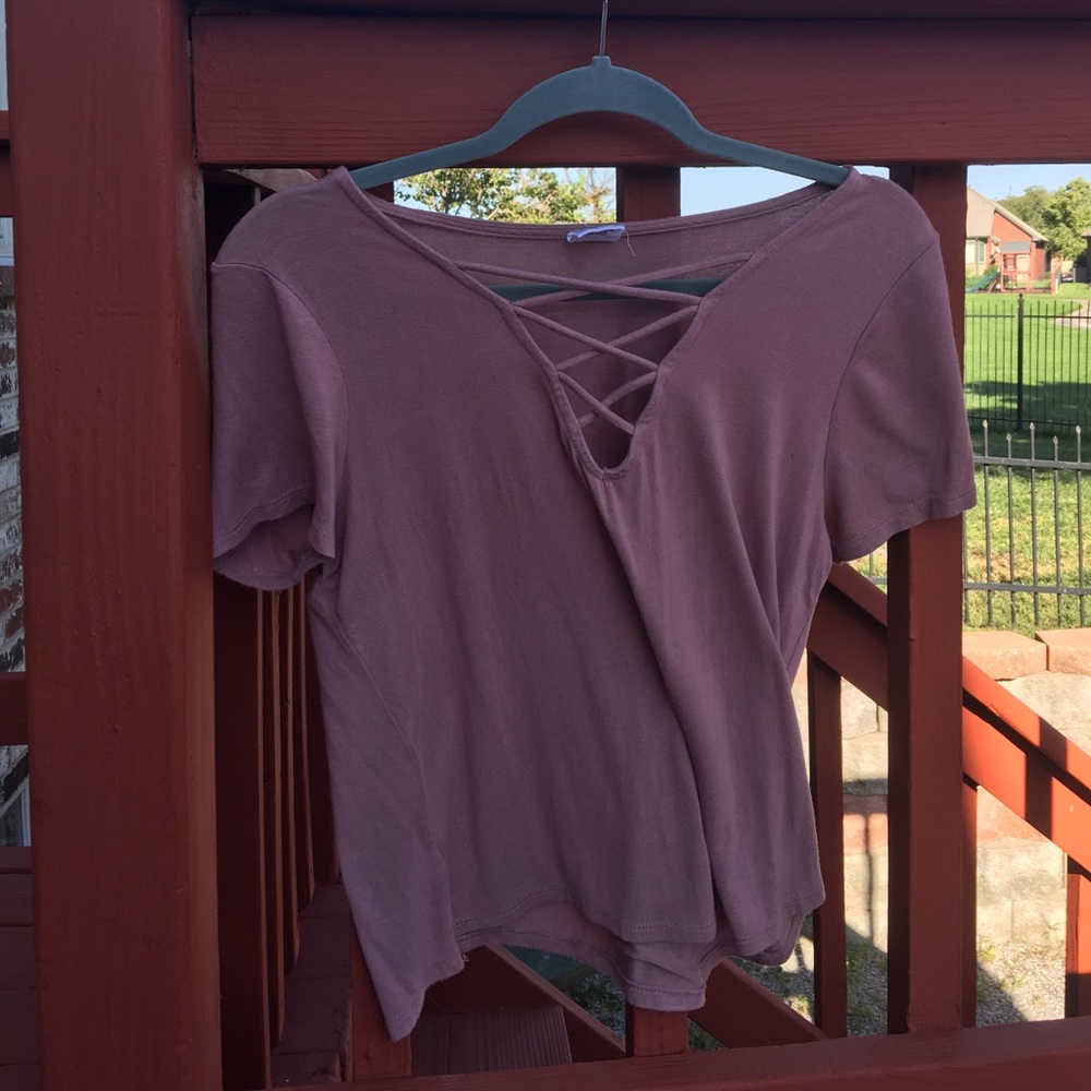 A pink Tillys top